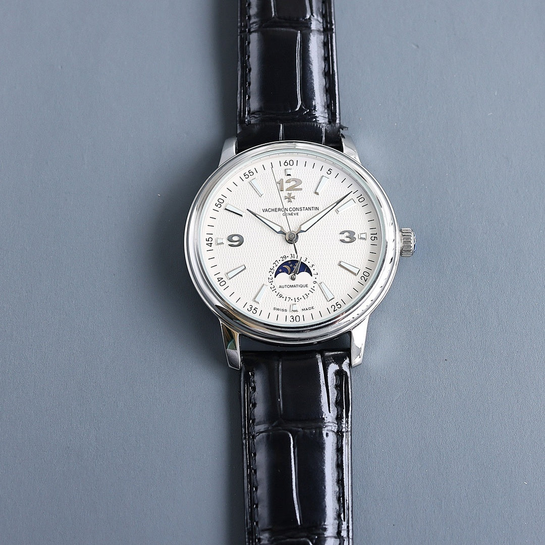 Automatic wristwatch, silver case and black leather strap, cream dial with subdial