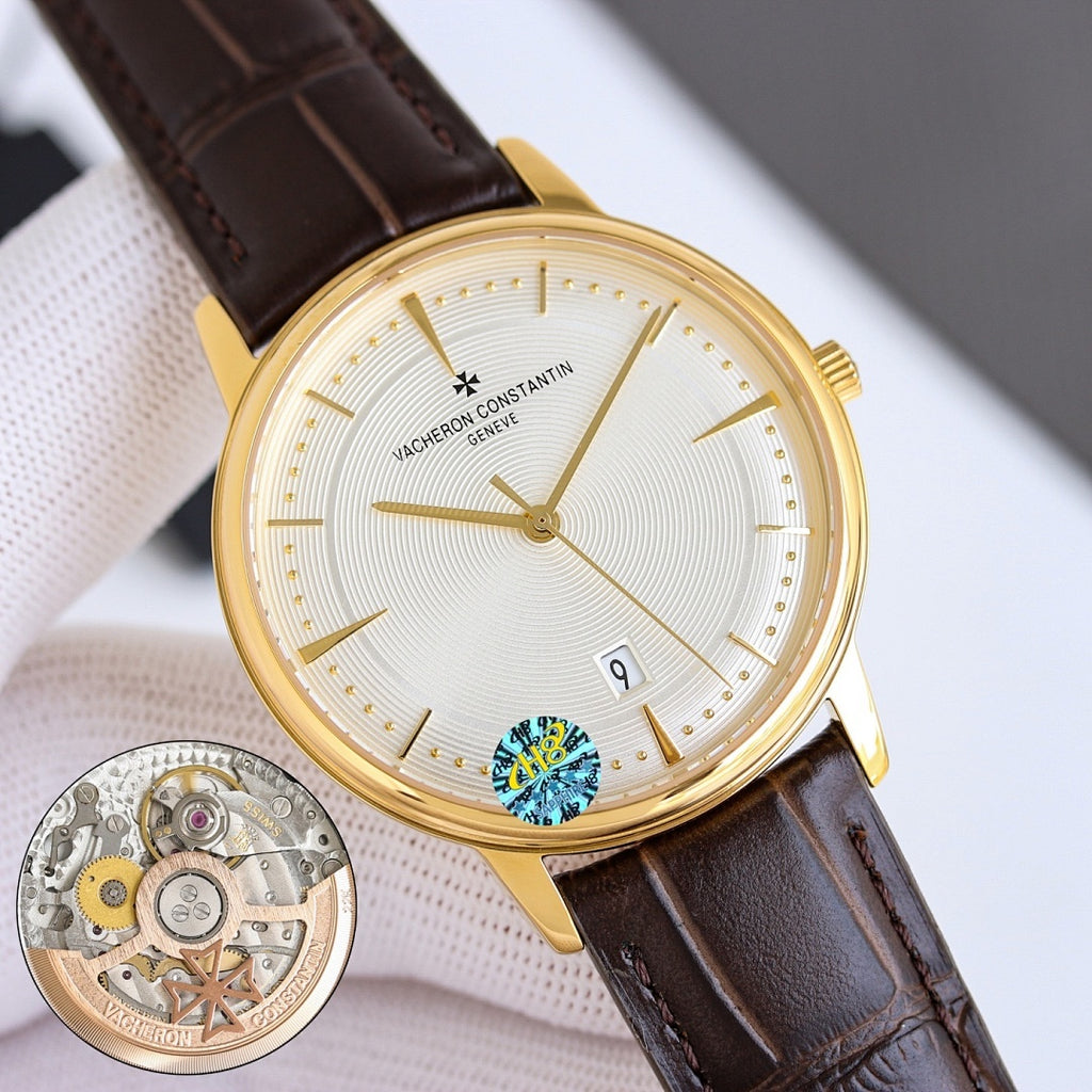 Gold dress watch with white dial, brown leather strap, gold hands, and date window at 9
