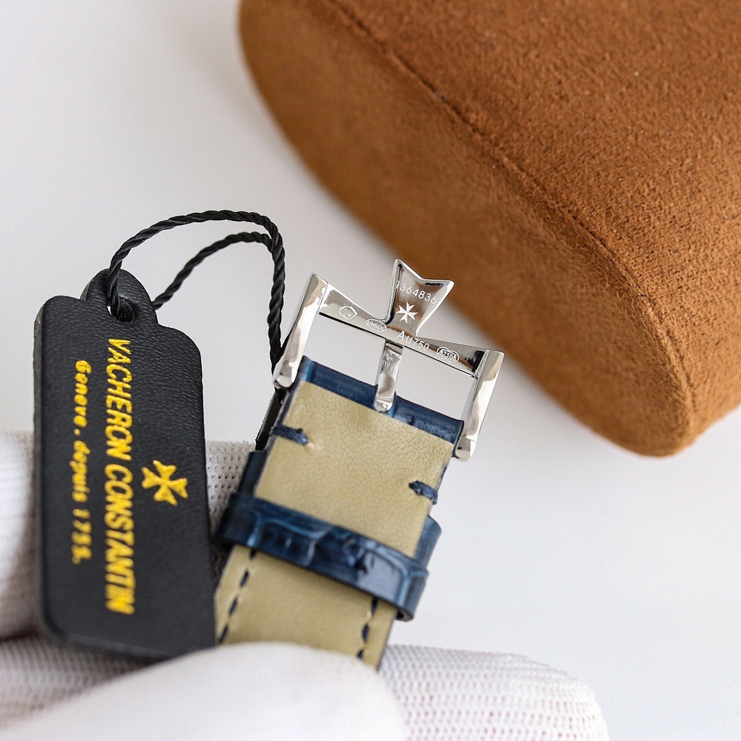 Wristwatch with blue leather strap, metal buckle clasp, and hanging brand tag