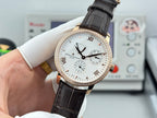 Luxury wristwatch side view with white dial, rose-gold case, black leather strap and bezel stones.