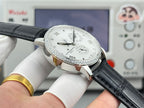 Vacheron Constantin wristwatch with silver case, white dial markers, black leather strap.