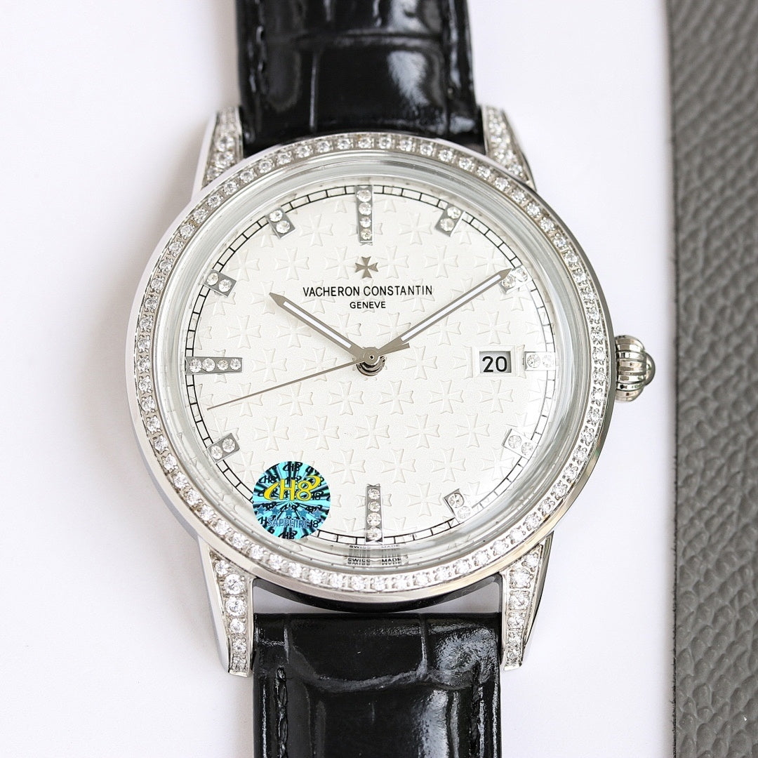 Silver wristwatch with white dial, diamond bezel, black leather strap and date window