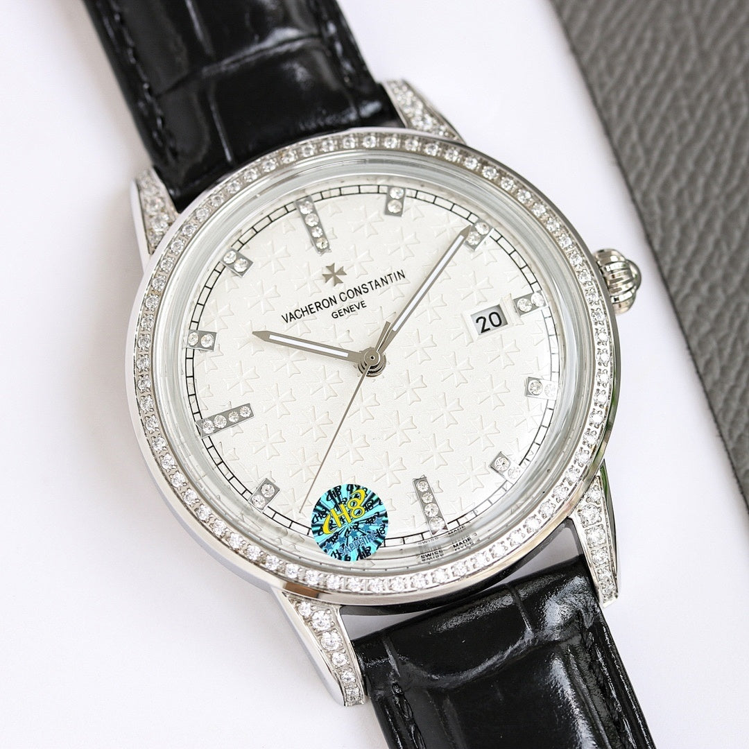 Silver wristwatch with white dial, diamond bezel, black leather strap, date 20