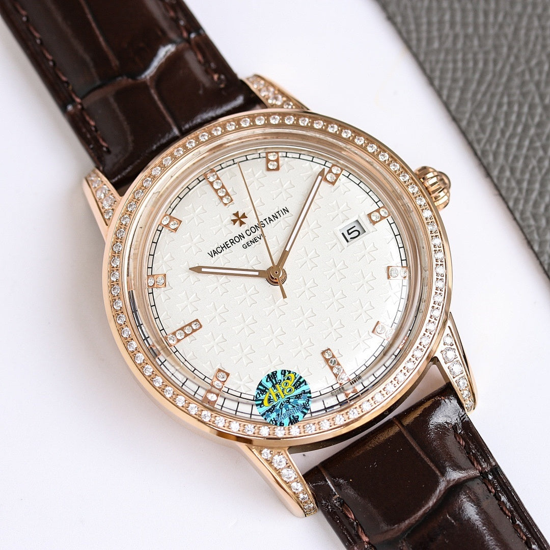 Rose gold wristwatch with white dial, diamond bezel, brown leather strap, date window