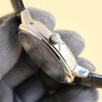 Vacheron Constantin watch side view with crown, polished steel case, black leather strap