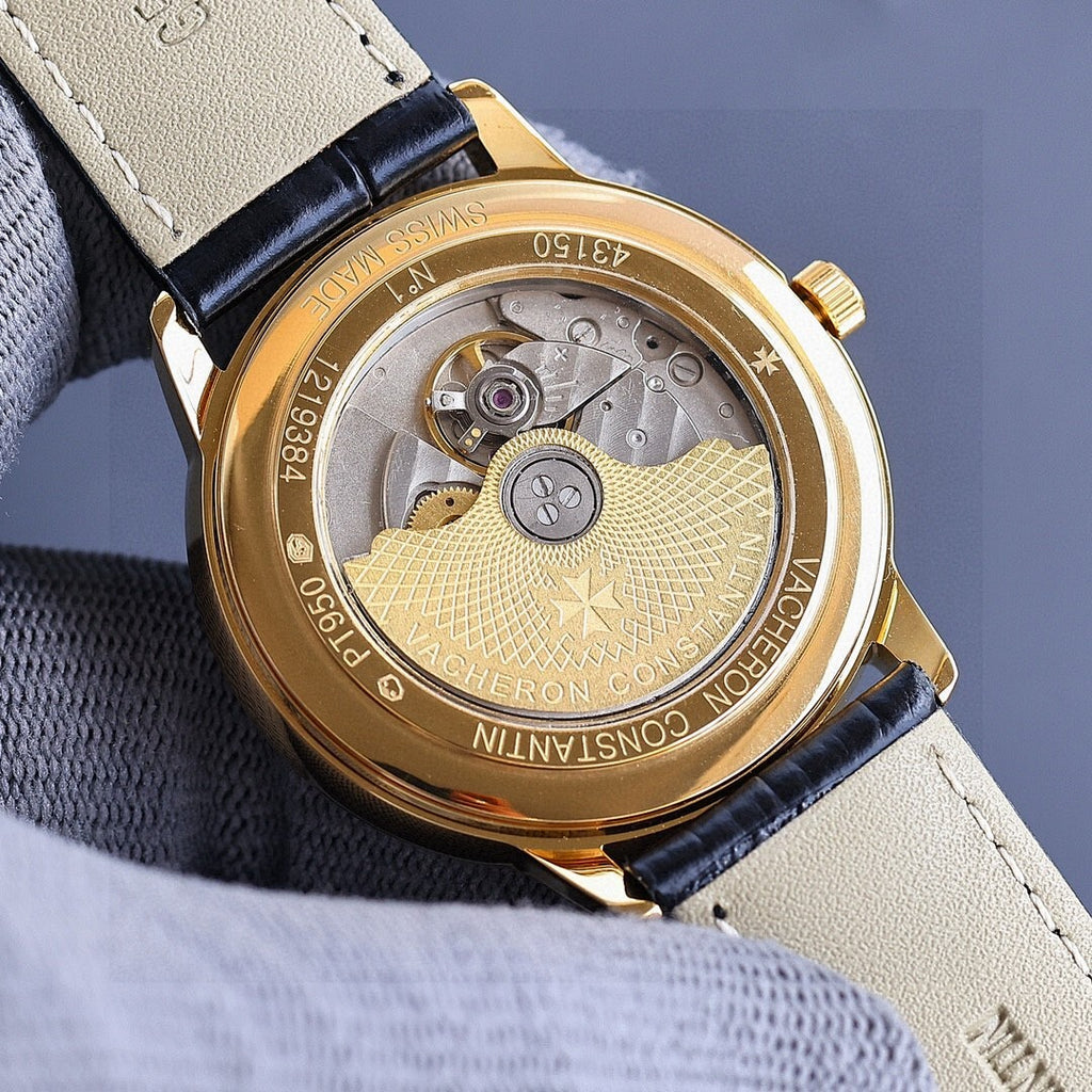 Vacheron Constantin watch caseback with gold rim and engraved medallion, on black strap