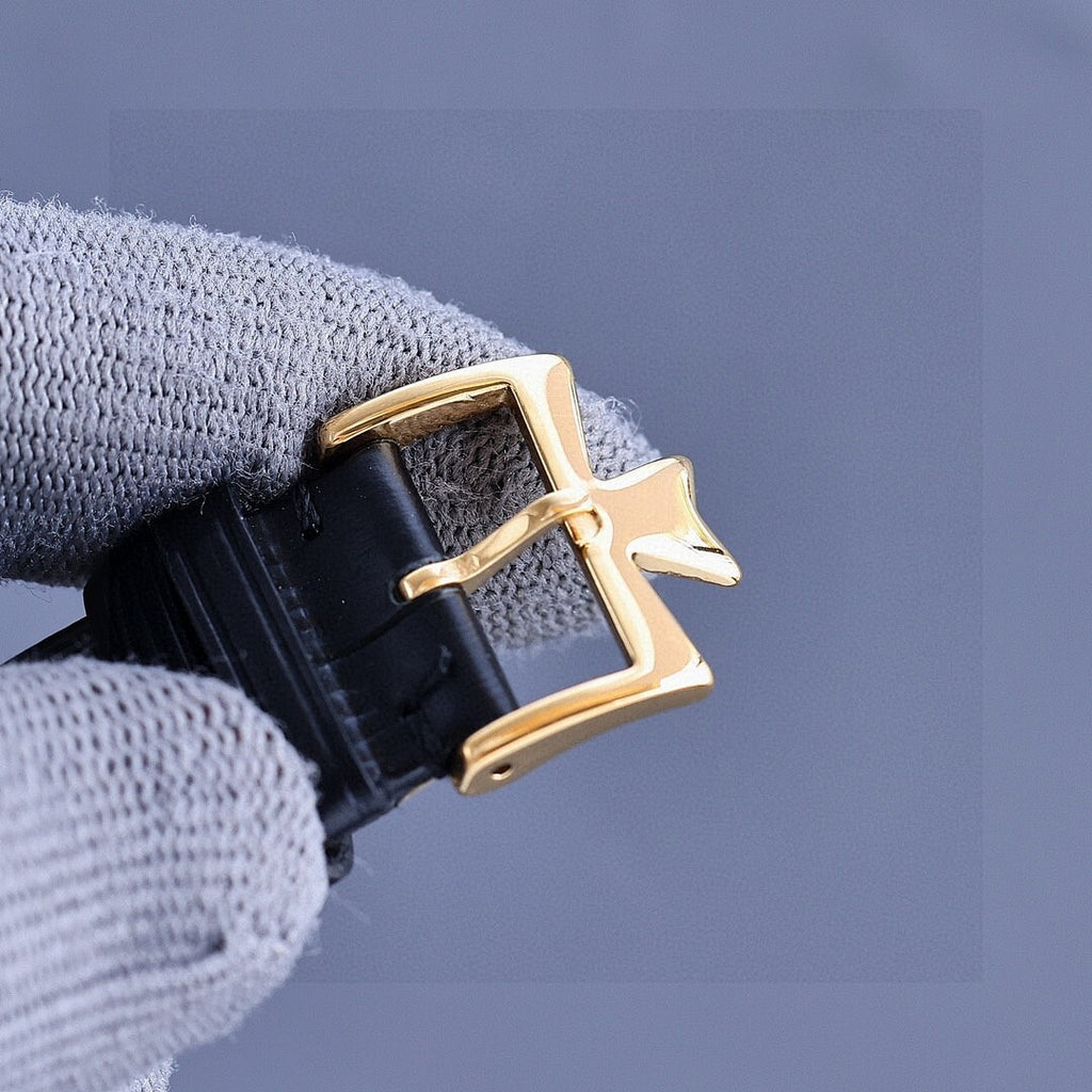 Vacheron Constantin watch with gold-tone case and black leather strap, side crown view