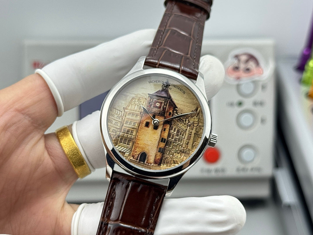 Watch with brown leather strap and silver case, gold-tone city dial held in hand.