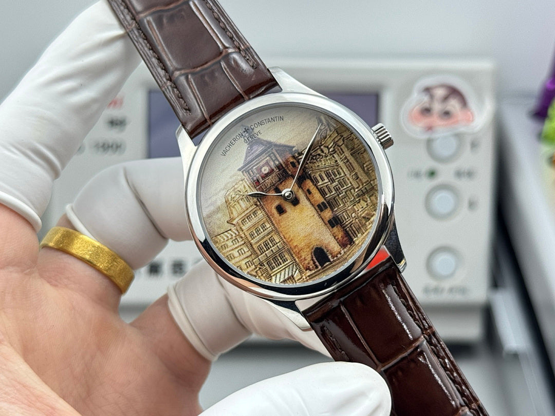 Watch with brown leather strap and silver case, architectural dial with visible crown.