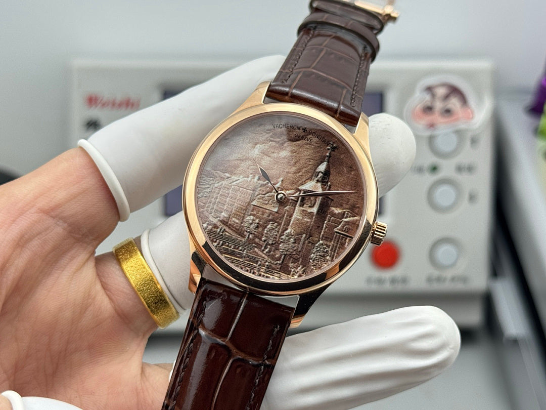 Gold-tone wristwatch with brown leather strap; sepia city dial and slender crown detail