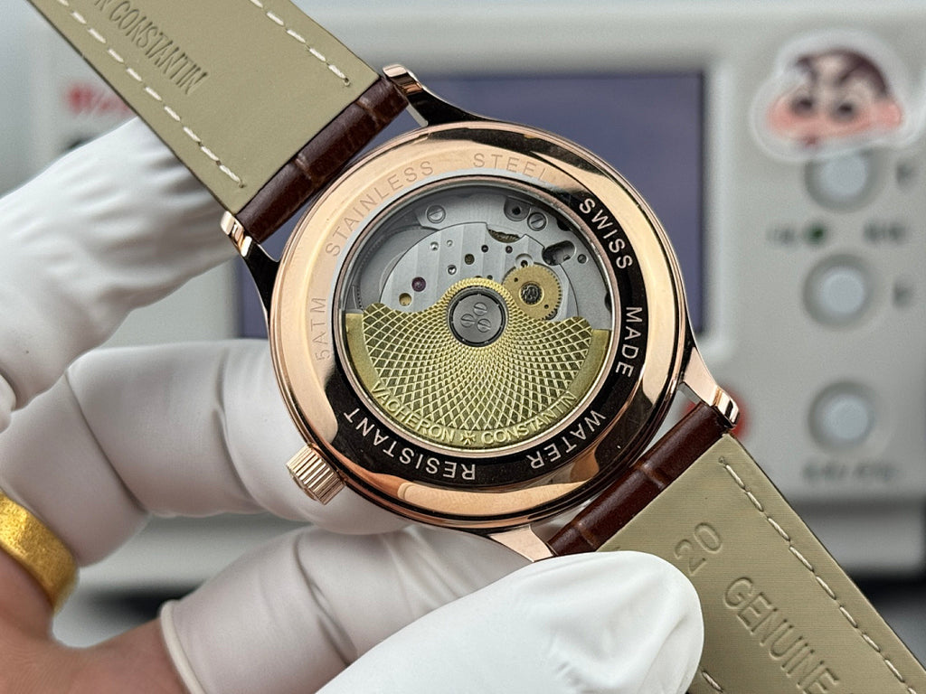 Vacheron Constantin wristwatch caseback view showing Swiss-made rotor, brown leather strap