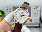 Vacheron Constantin wristwatch on wrist: white dial and brown leather strap, gold-tone case