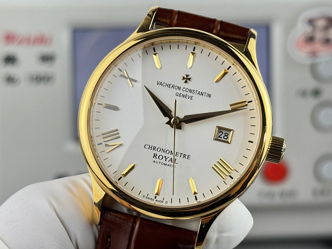 Vacheron Constantin watch with brown leather strap, gold case, white dial, date at 28