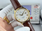 Vacheron Constantin watch with brown leather strap, gold bezel, white dial, date window