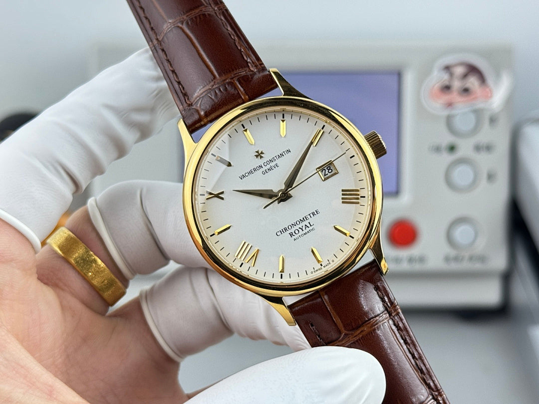 Vacheron Constantin watch with brown leather strap, gold bezel, white dial, date window