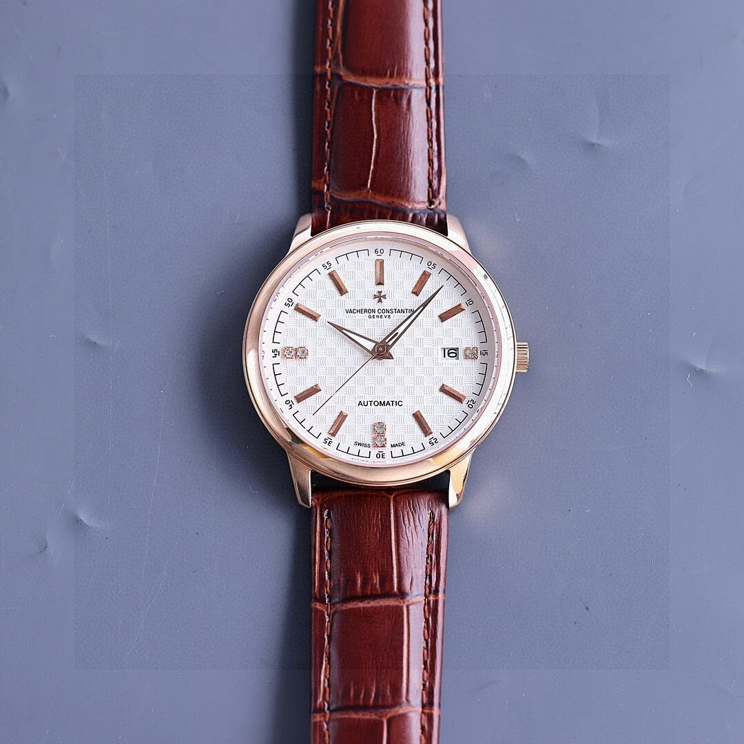 Vacheron Constantin watch, white dial with rose-gold case, brown leather strap, slim hour markers.