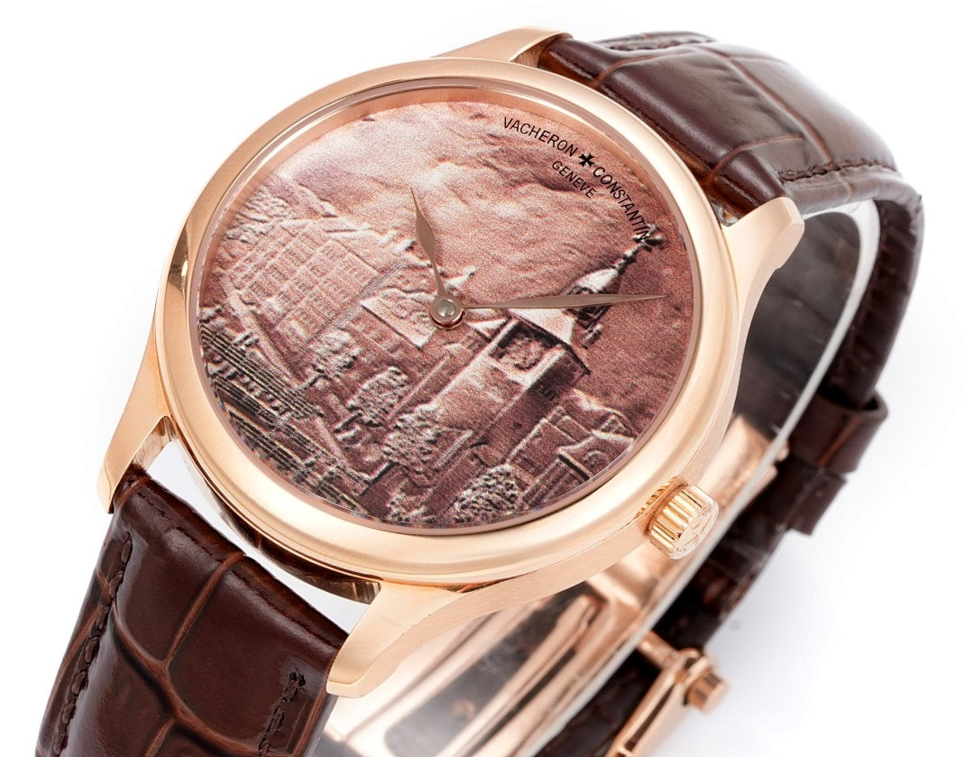 Rose-gold wristwatch angled view with brown leather strap and city dial