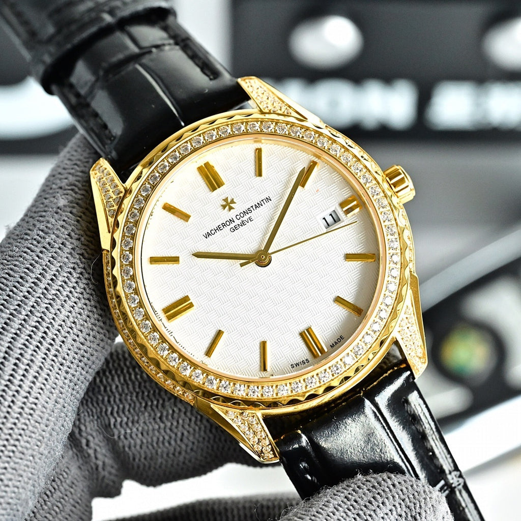 Vacheron Constantin watch with gold bezel, white dial, and black leather strap.