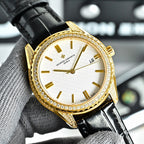 Vacheron Constantin watch with gold bezel, white dial, and black leather strap.