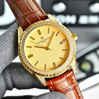 Vacheron Constantin watch with gold bezel, yellow dial, and brown leather strap.