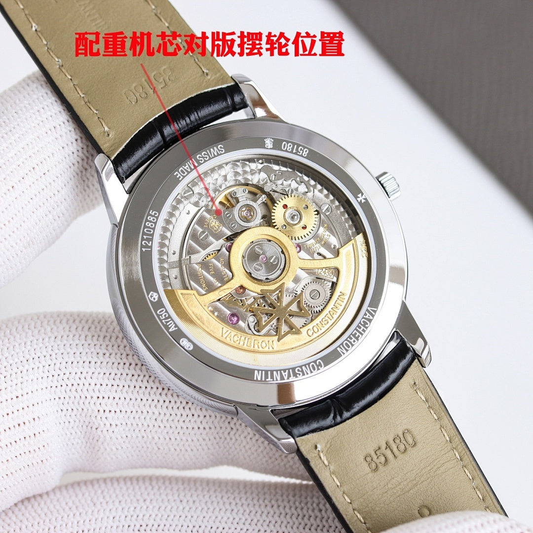 Wristwatch with open case showing mechanical movement, silver with brown leather strap.