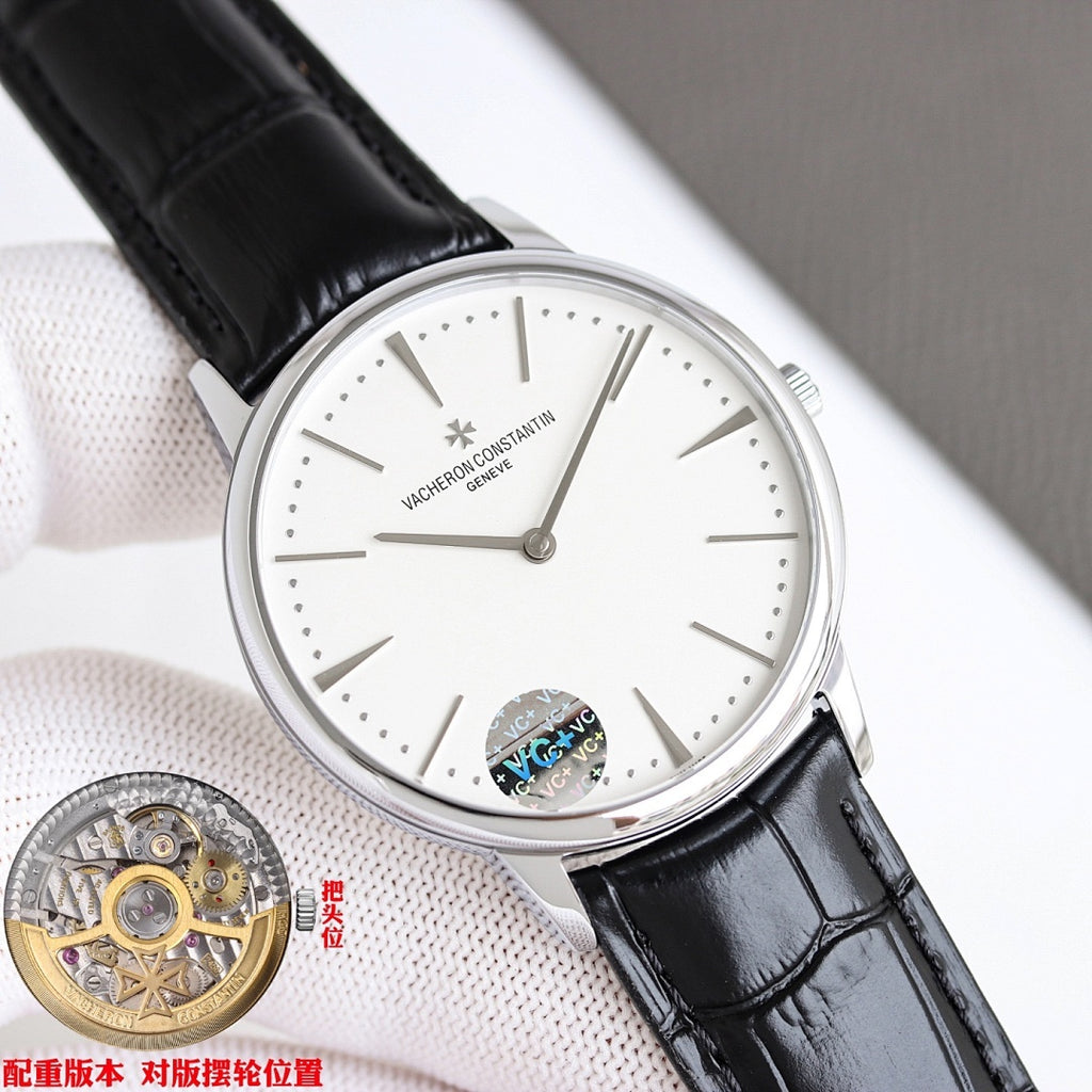Luxury wristwatch with white dial and black leather strap, silver case and slim hands.