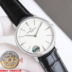 Luxury wristwatch with white dial and black leather strap, silver case and slim hands.