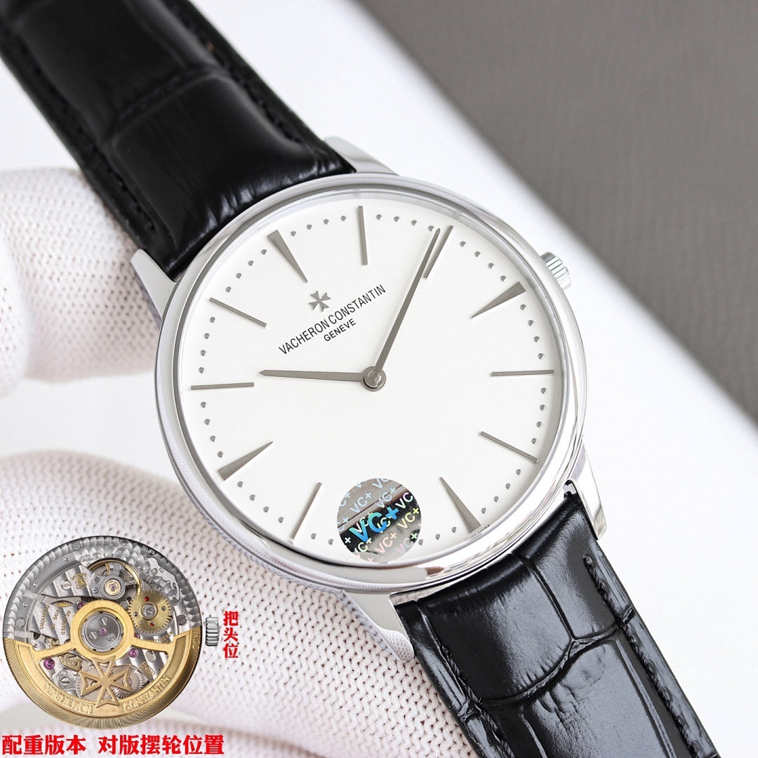 Luxury wristwatch with white dial and black leather strap, silver case and slim hands.