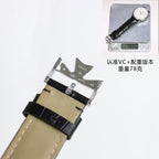 Wristwatch with black leather strap and silver buckle, side view.