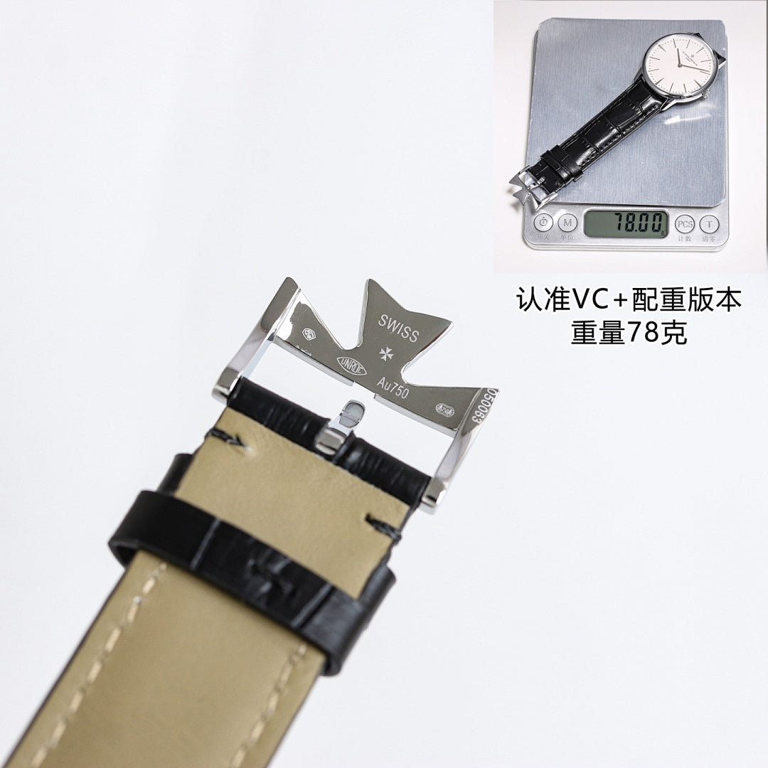 Wristwatch with black leather strap and silver buckle, side view.