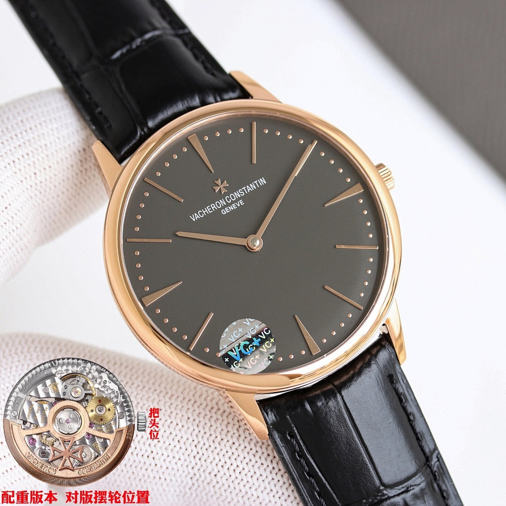 Black-dial watch with black leather strap and rose-gold case, angled close-up