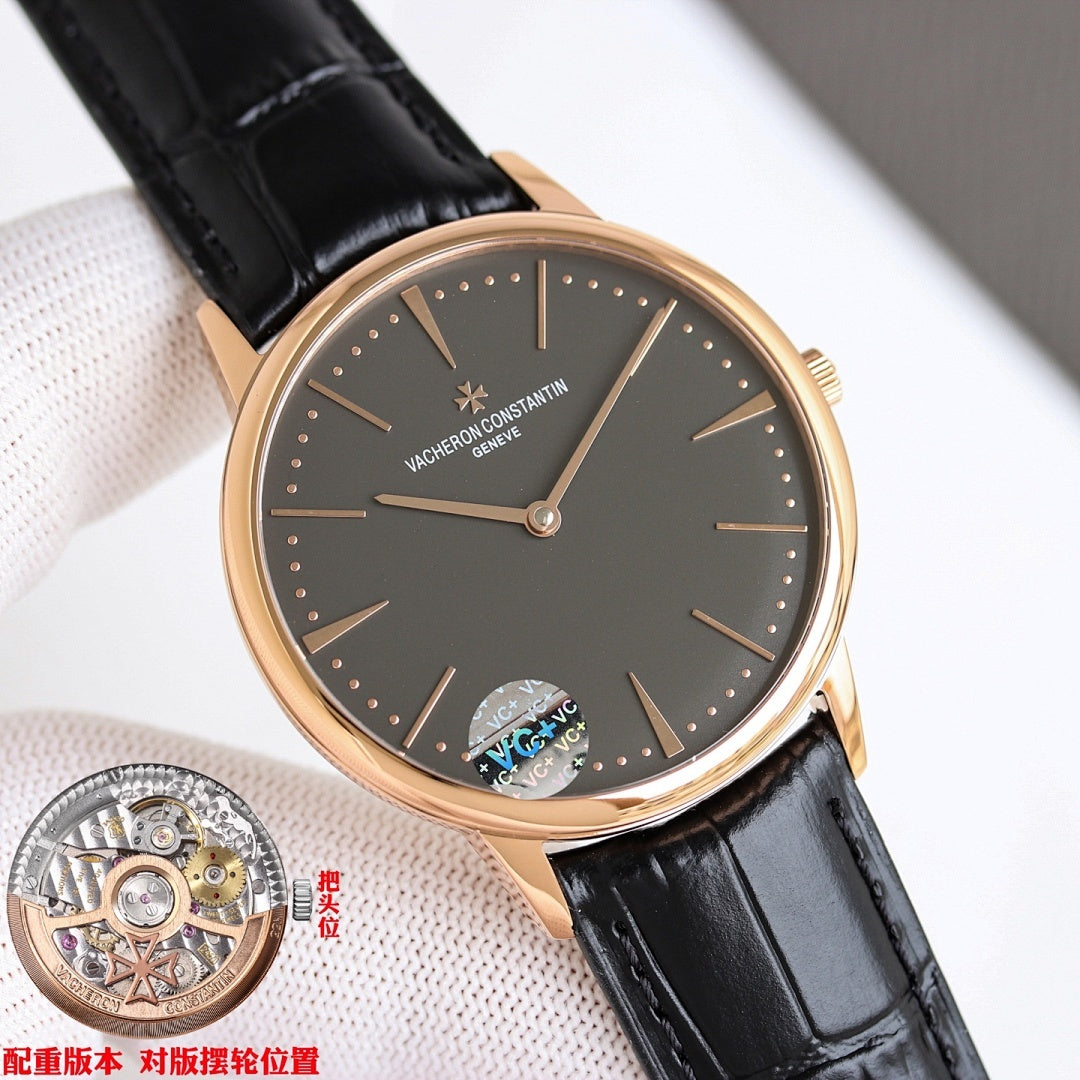 Black-dial watch with black leather strap and rose-gold case, angled close-up