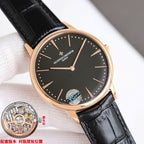 Black-dial watch with black leather strap and rose-gold case, crown detail at right