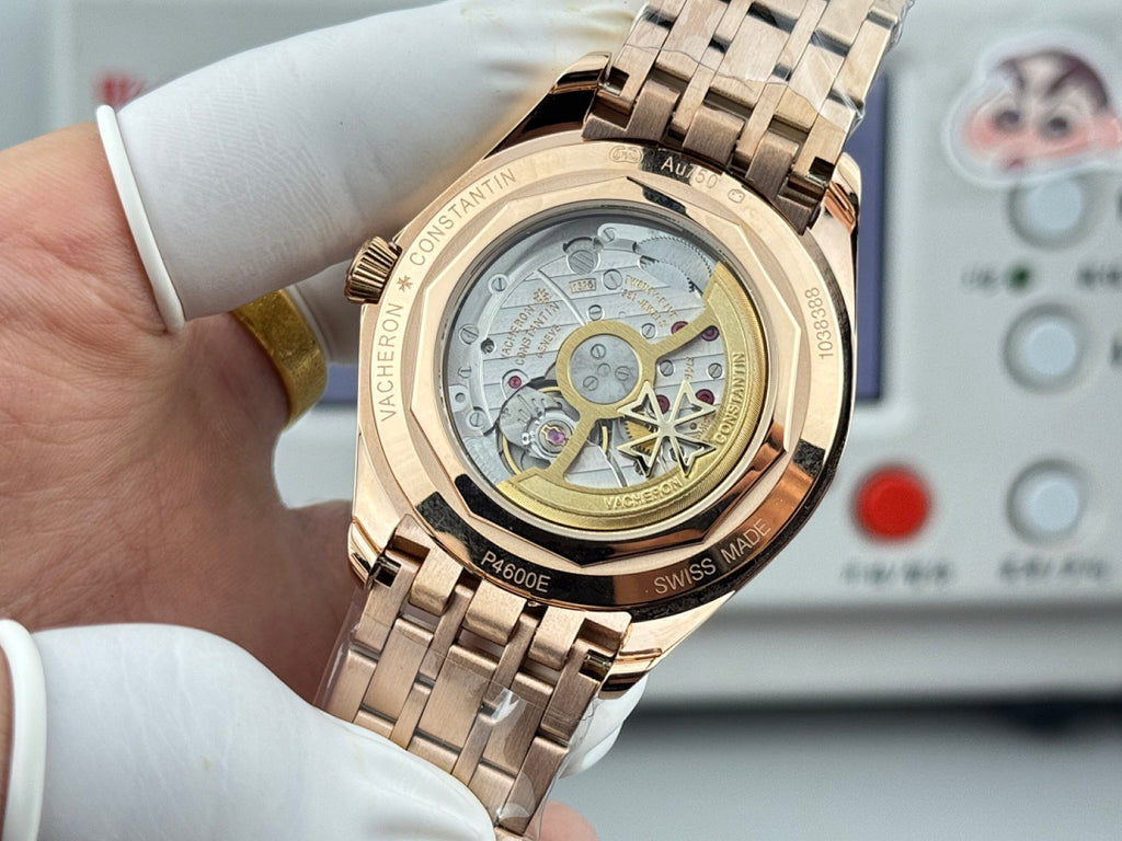 Vacheron Constantin wristwatch with gold-tone case, open dial detail on metal bracelet.