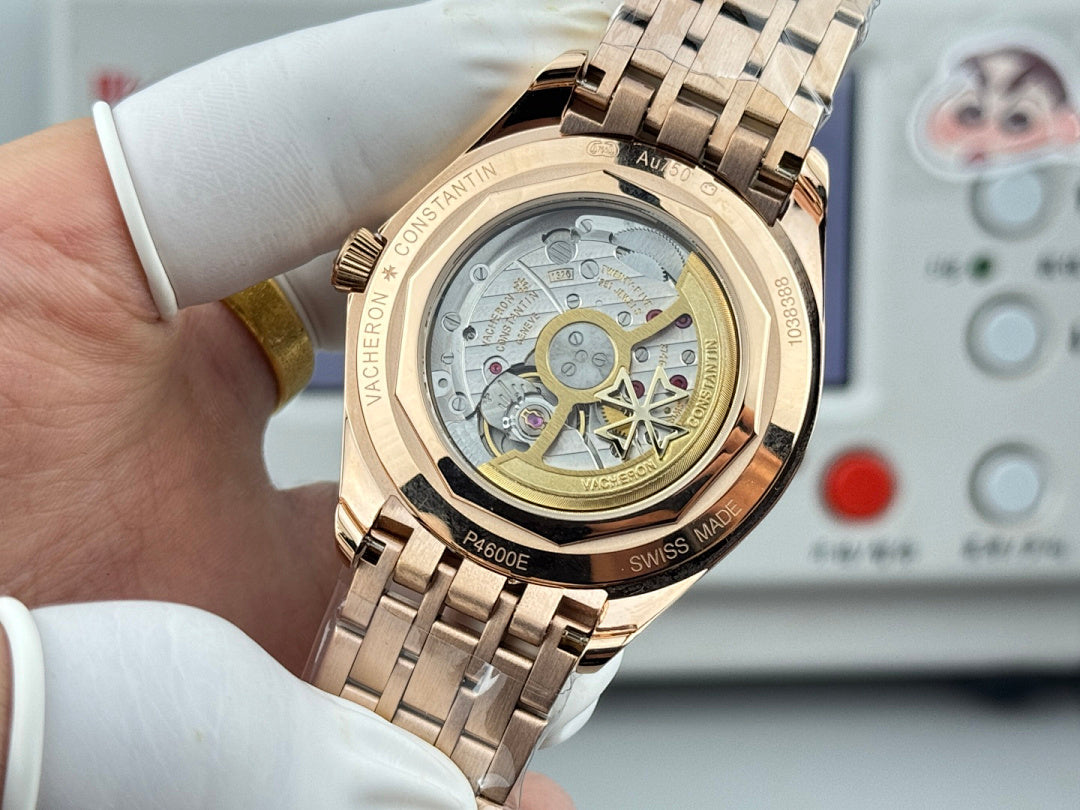 Vacheron Constantin wristwatch with gold-tone case, open dial detail on metal bracelet.