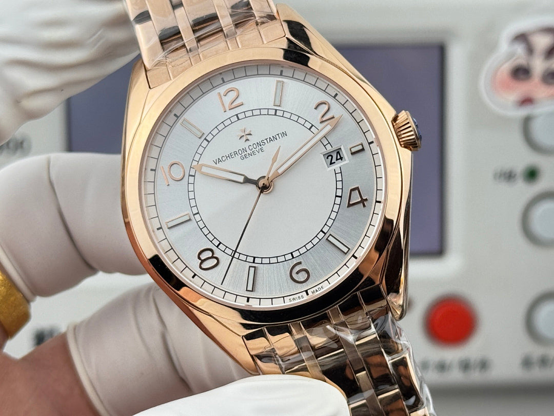 Vacheron Constantin wristwatch close-up, gold-tone case with light dial on metal bracelet.