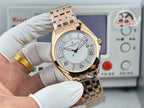 Vacheron Constantin wristwatch front view with gold-tone bracelet and light dial on wrist.