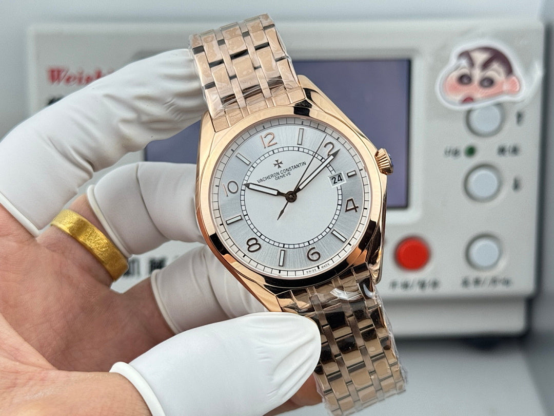 Vacheron Constantin wristwatch front view with gold-tone bracelet and light dial on wrist.