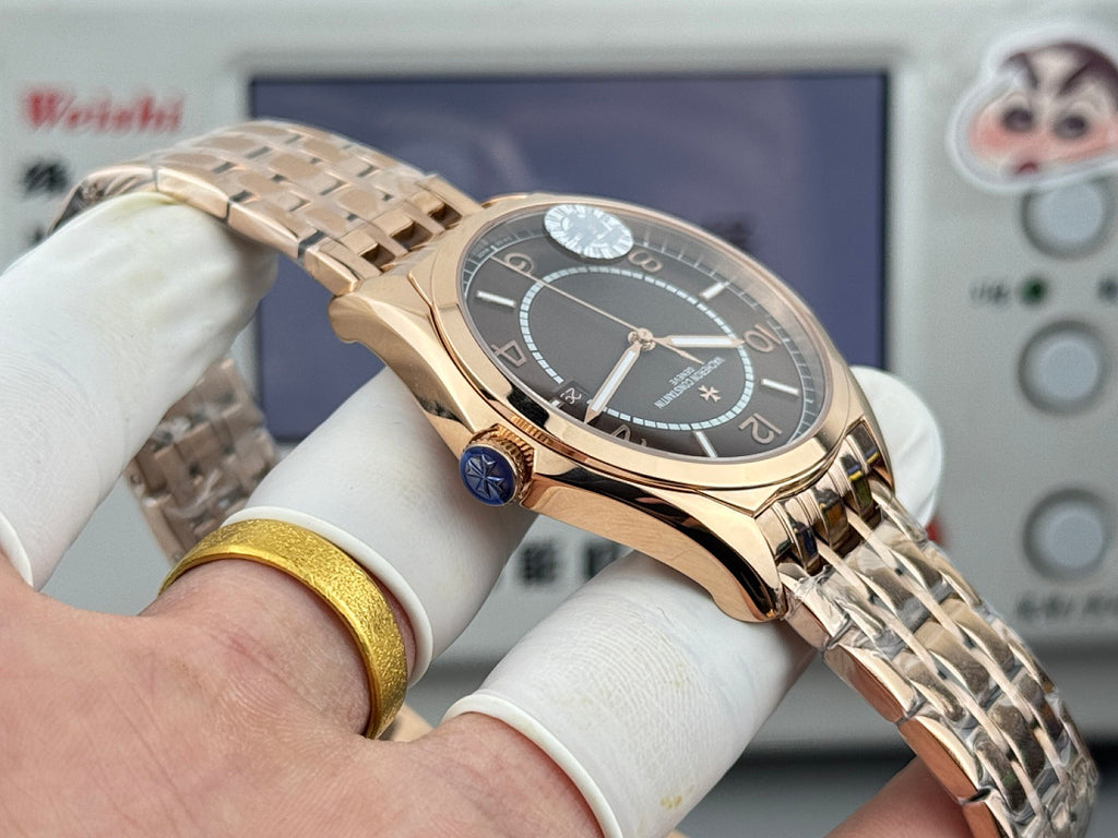 Vacheron Constantin gold-tone wristwatch with black dial and side crown