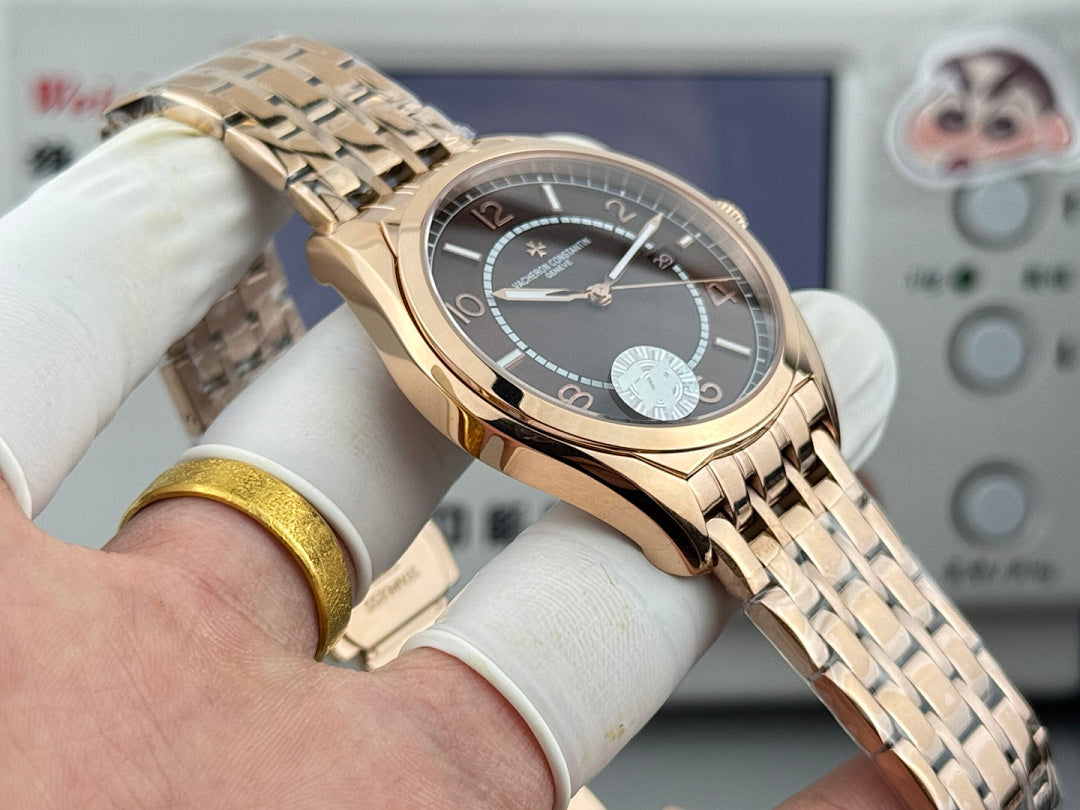 Vacheron Constantin gold-tone wristwatch with black dial, subdial and date window