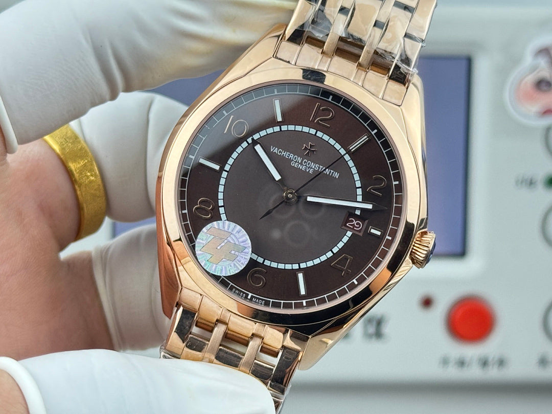 Vacheron Constantin gold-tone wristwatch with black dial, subdial and date display