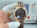 Vacheron Constantin gold-tone wristwatch with black dial and metal bracelet