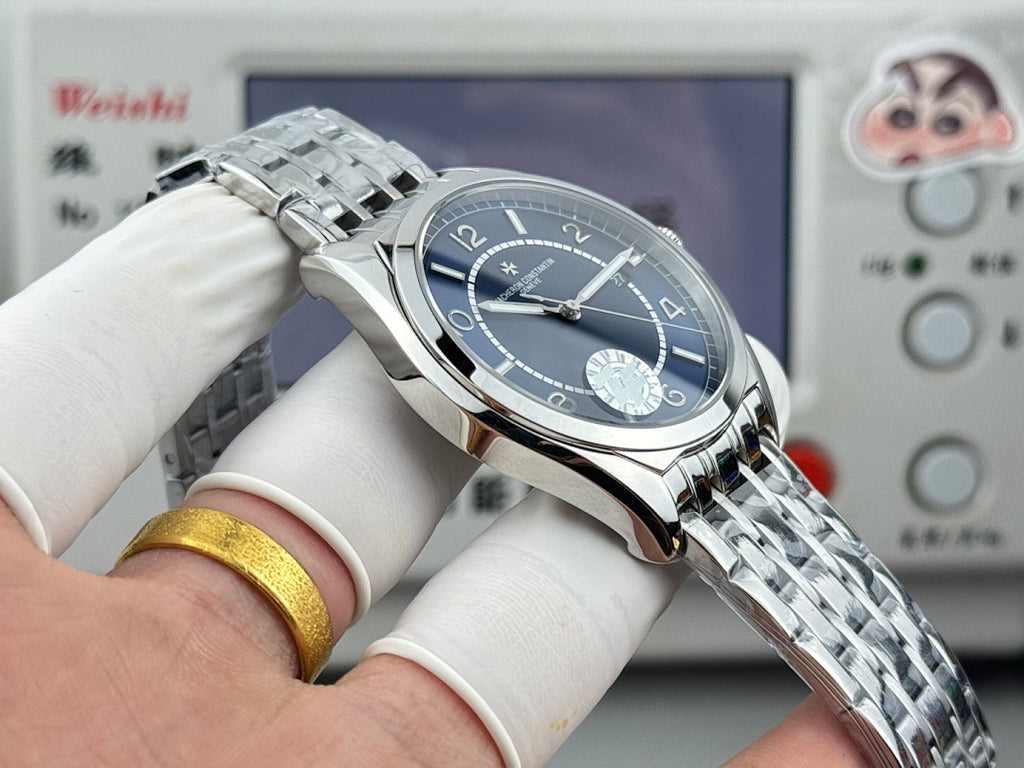 Vacheron Constantin wristwatch angled with blue dial, steel bezel, and polished stainless links