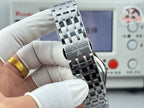 Vacheron Constantin wristwatch viewed from the side, stainless steel bracelet and blue bezel