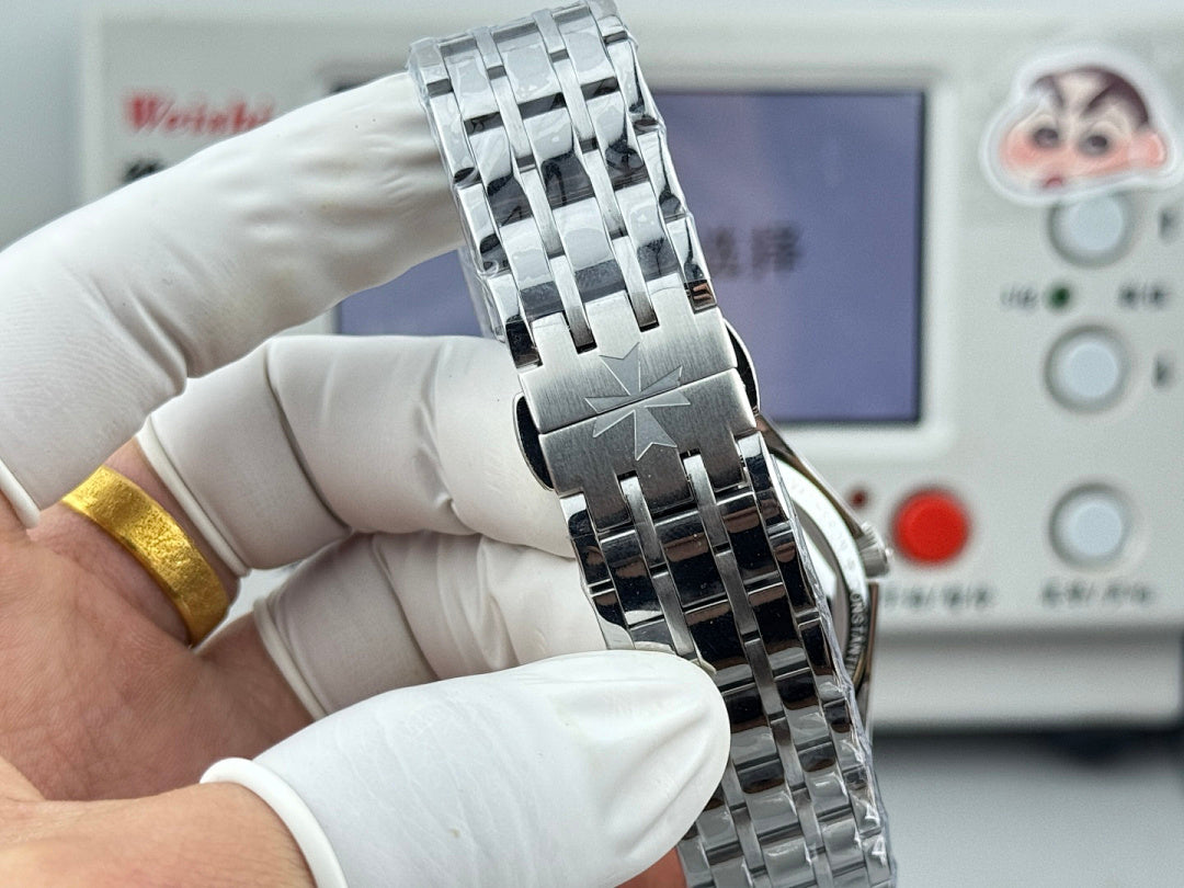 Vacheron Constantin wristwatch viewed from the side, stainless steel bracelet and blue bezel