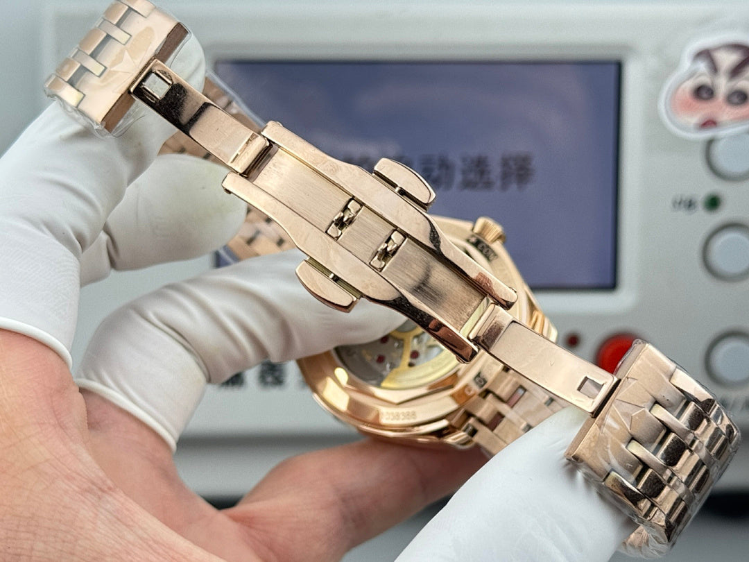 Gold-tone wristwatch with hinged metal bracelet and crown on the side