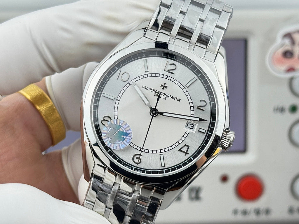 Vacheron Constantin wristwatch close-up with white dial, black bezel, and date window