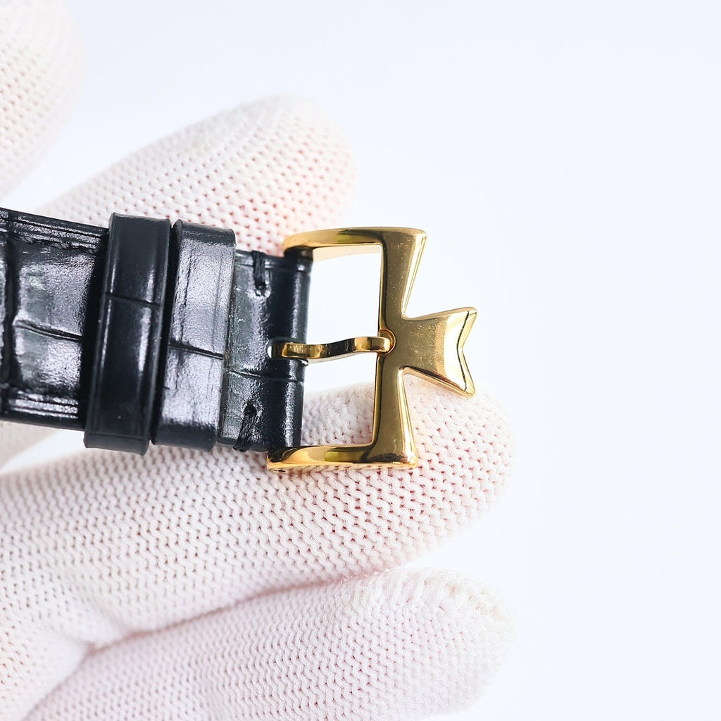 Black leather watch strap buckle with gold clasp