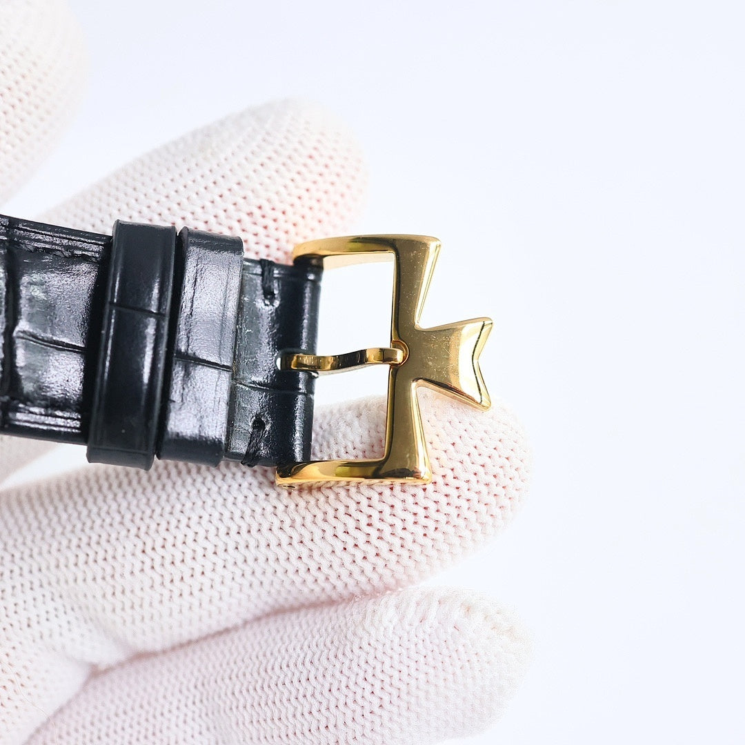 Black leather watch strap buckle with gold clasp