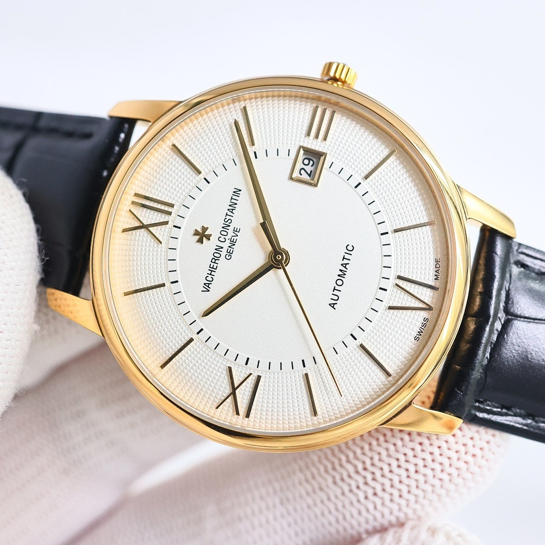 Automatic wristwatch with white dial, baton indexes, date window at 3, gold case, black strap